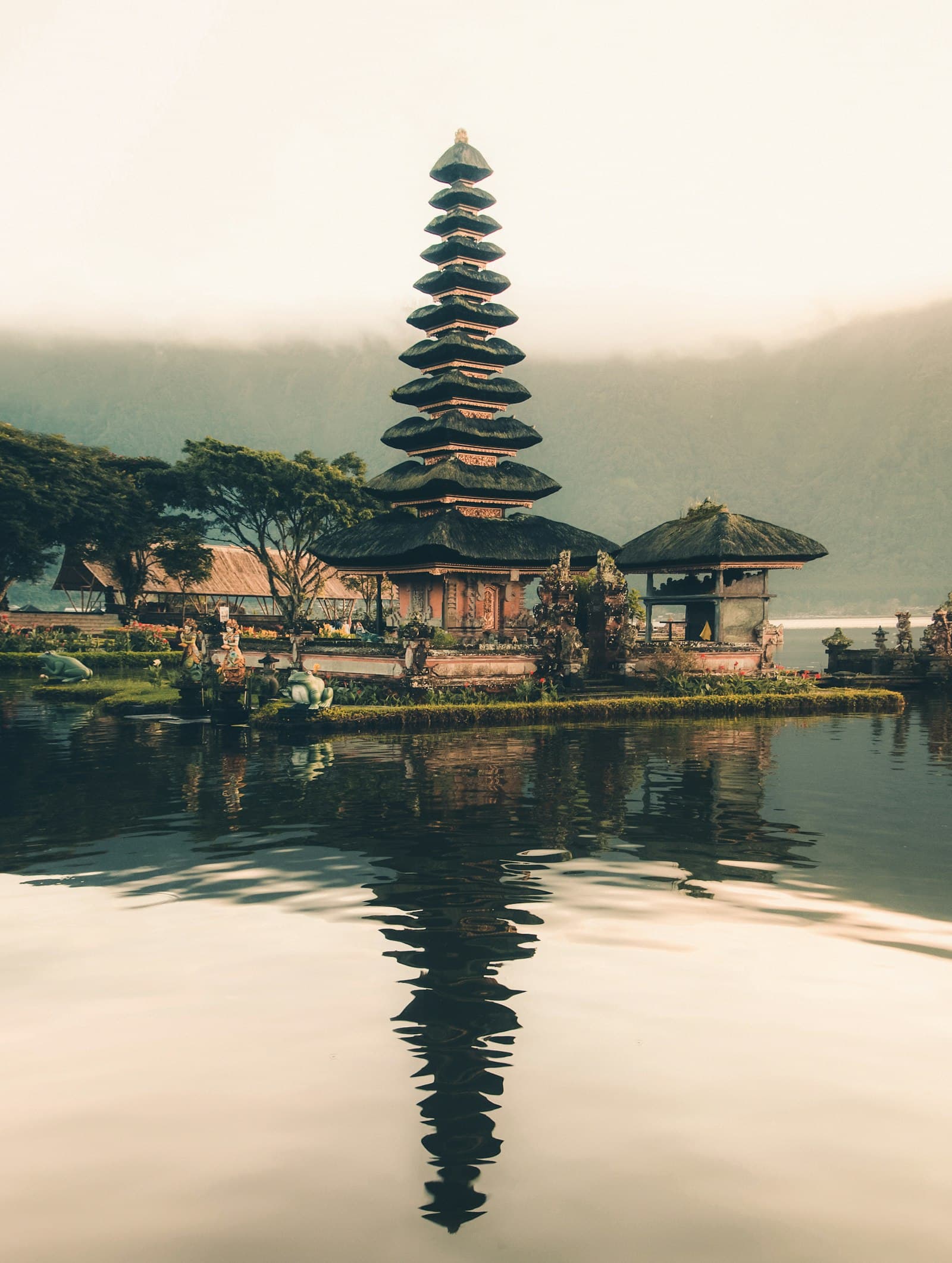 Temple and palm trees in Bali at golden hour